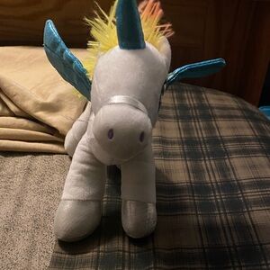 Plush Unicorn Toy with Blue and Yellow Accents